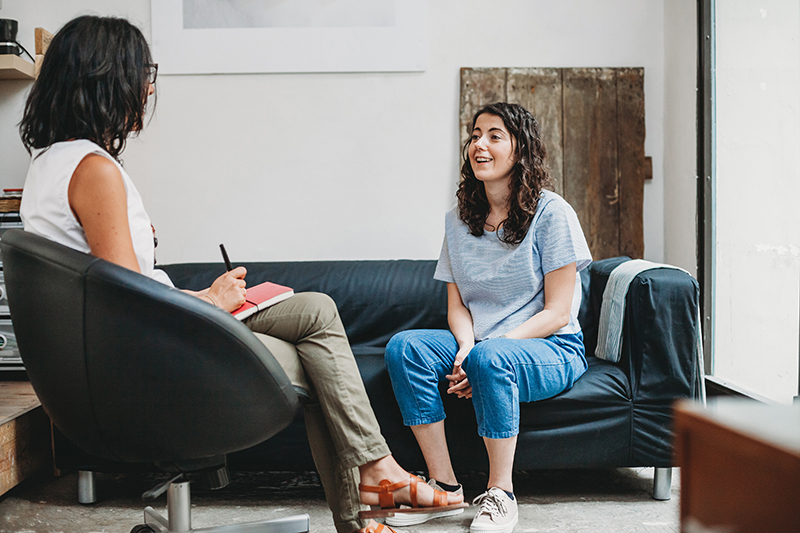 Psychotherapy session, woman talking to his psychologist in the